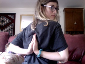 Image: Me, Beth, doing "reverse Namaskar"  (folding my arms behind my back and touching my palms together like I'm praying).